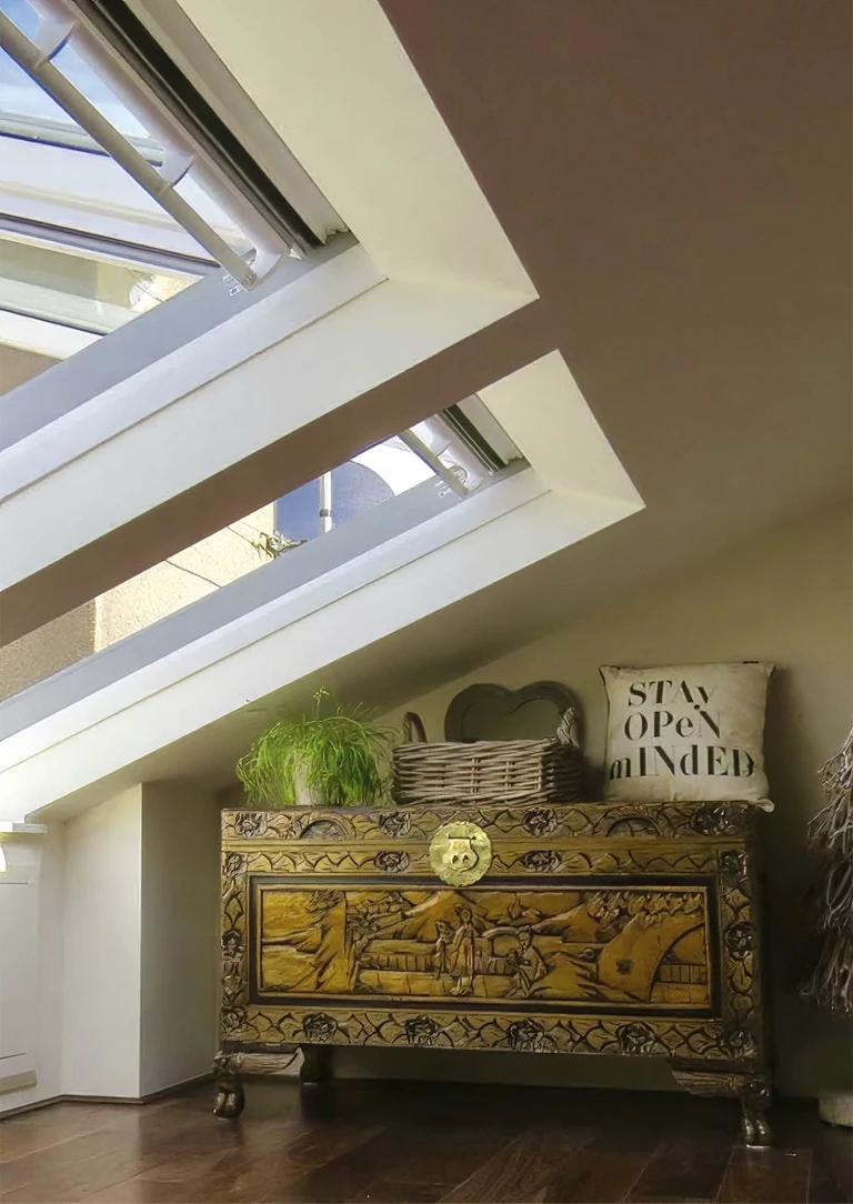 Attic conversion space with new floor, walls and built in windows